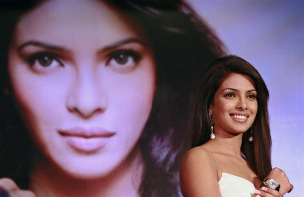 Bollywood actress Priyanka Chopra smiles during an event to promote a watch brand in New Delhi March 12, 2007. (REUTERS)