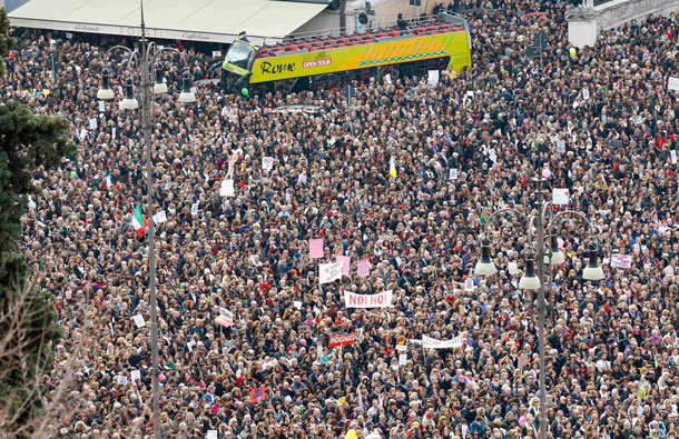 People gather in Rome's Piazza del Popolo to demonstrate against Italy's Prime Minister Silvio Berlusconi. Women rallied across Italy on Sunday, incensed by Berlusconi's sex scandal which they say has hurt their dignity and reinforced outdated gender stereotypes. (REUTERS)