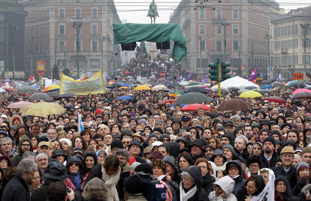 People march against Italian premier Silvio Berlusconi during a protest in Milan, Italy. Thousands of women turned out in 200 Italian cities to denounce what they say is Berlusconi's debasing of females. Prosecutors want to try Berlusconi for allegedly paying a 17-year-old Moroccan girl for sex. Paying for prostitution with a minor is a crime in Italy. Berlusconi and the teenager have denied the allegation. (AP)