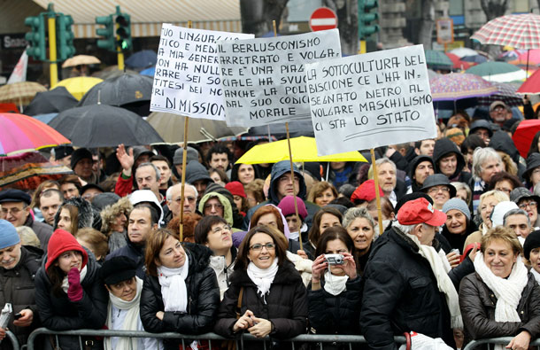 People gather during a national demonstration to appeal for greater dignity for Italian women at Piazza Castello in Milan, Italy. Women rallied across Italy incensed by Prime Minister Silvio Berlusconi's sex scandal which they say has hurt their dignity and reinforced outdated gender stereotypes. (GETTY IMAGES)
