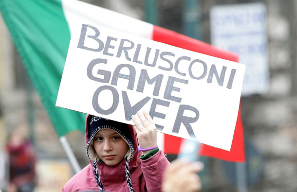 A girl holds a banner during the national demonstration to appeal for greater dignity for Italian women in Milan, Italy. Thousands of women gathered this morning in many cities in Italy to demonstrate against the recent sex scandals surrounding Italian Prime Minister Silvio Berlusconi. (GETTY IMAGES)