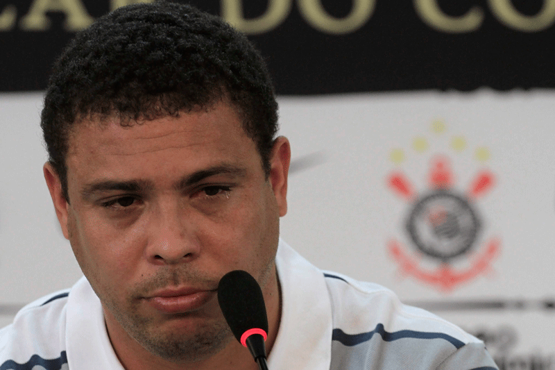 Former Brazil striker Ronaldo cries during a news conference in Sao Paulo on Monday. (REUTERS)