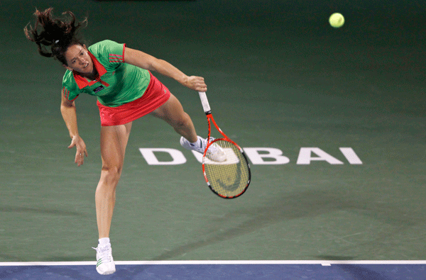 Patty Schnyder of Switzerland serves to Ana Ivanovic of Serbia during their match at the WTA Dubai Tennis Championships on Tuesday. (REUTERS)