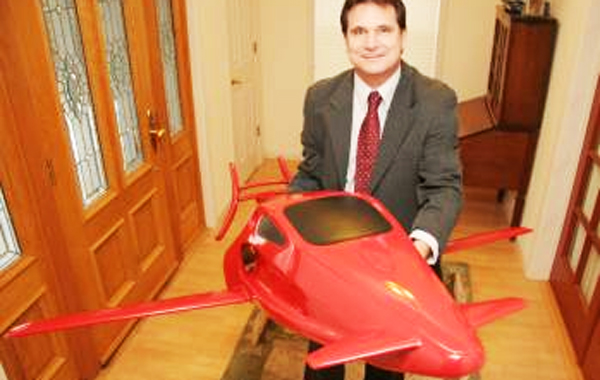 Meadow Vista resident Sam Bousfield stands with the model of his Switchblade flying car. (AGENCIES)