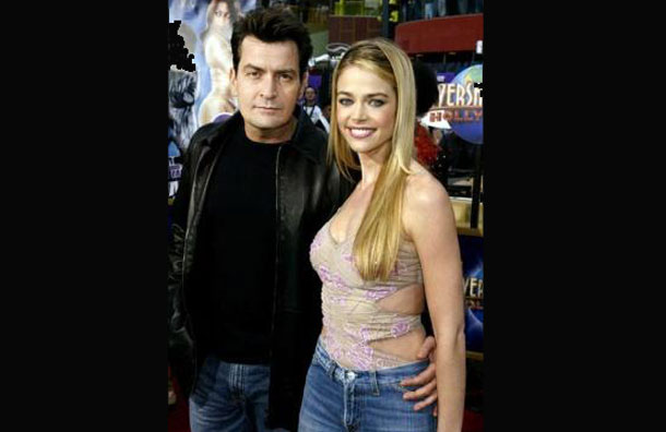 Actress Denise Richards star of the live-action comedy film "Undercover Brother" poses with actor Charlie Sheen as they arrive for the film's premiere in Los Angeles, May 30, 2002. (REUTERS)