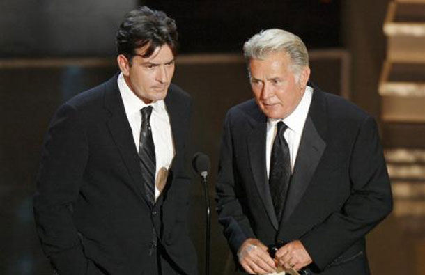 Charlie Sheen and his father Martin Sheen present the best supporting actress in a miniseries or movie award during the 58th annual Primetime Emmy Awards at the Shrine Auditorium in Los Angeles August 27, 2006. (REUTERS)
