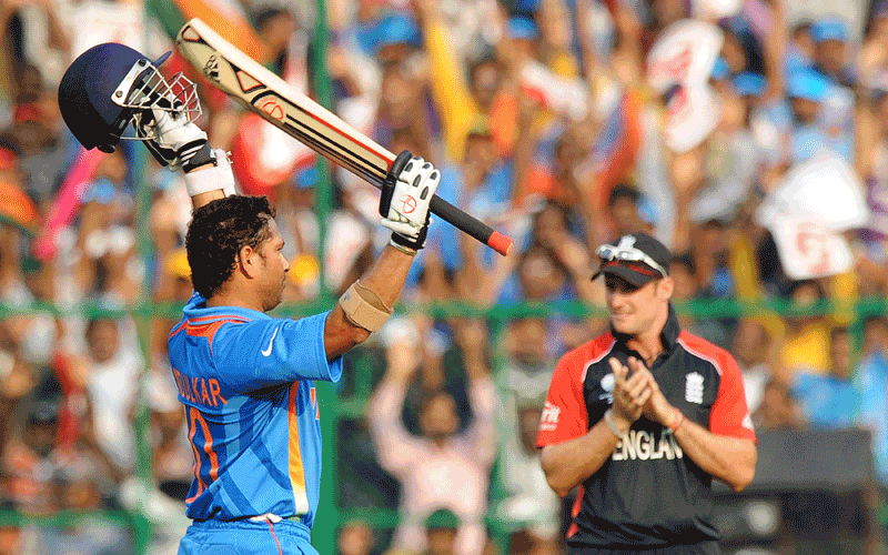 Indian cricketer Sachin Tendulkar celebrates after scoring a century(100 runs) during the ICC Cricket World Cup 2011 match between England and India at the M. Chinnaswamy Stadium in Bangalore.  (AFP)