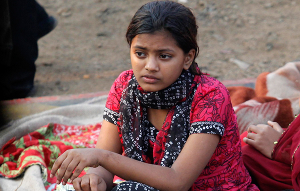 Rubina Ali, who acted as young Latika in the oscar-winning film "Slumdog Millionaire", sits amid the ruins of the Gharib Nagar slum in Mumbai. (REUTERS)