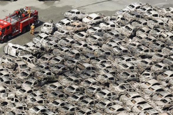 Burned-out cars are pictured at Hitachi Harbour in Ibaraki Prefecture in northeastern Japan. (REUTERS)