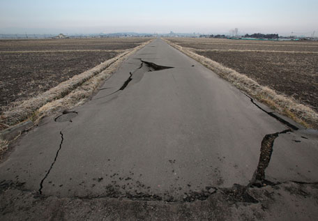 A damaged road is seen after an 8.9 magnitude strong earthquake struck on March 11 off the coast of north-eastern Japan, on March 13, 2011 in Sendai, Japan. The quake struck offshore at 2:46pm local time, triggering a tsunami wave of up to 10 metres which engulfed large parts of north-eastern Japan. The death toll is currently unknown, with fears that the current hundreds dead may well run into thousands. (GETTY IMAGES)