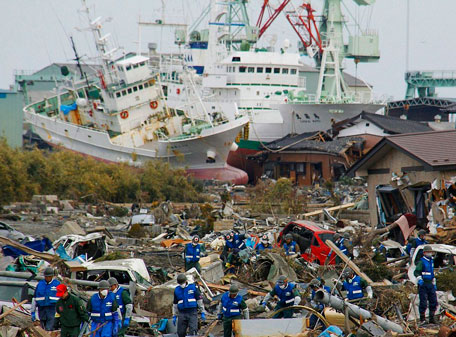 The Japanese army search for bodies in Higashimatsushima City, in Miyagi, the state where up to 10,000 people may have died.