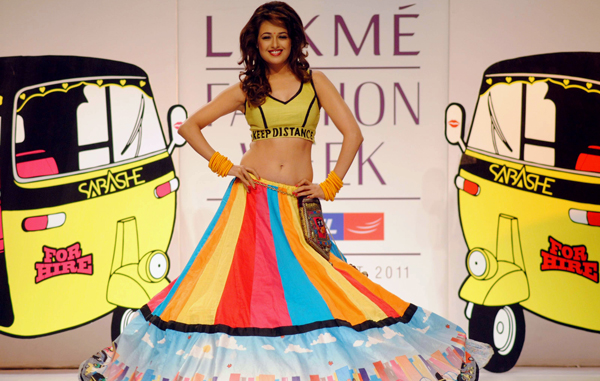 Indian Bollywood actress Yuvika Chaudhary displays a creation by designer Sabah Khan during the fourth day of 2011 Lakme Fashion Week in Mumbai. (AFP)
