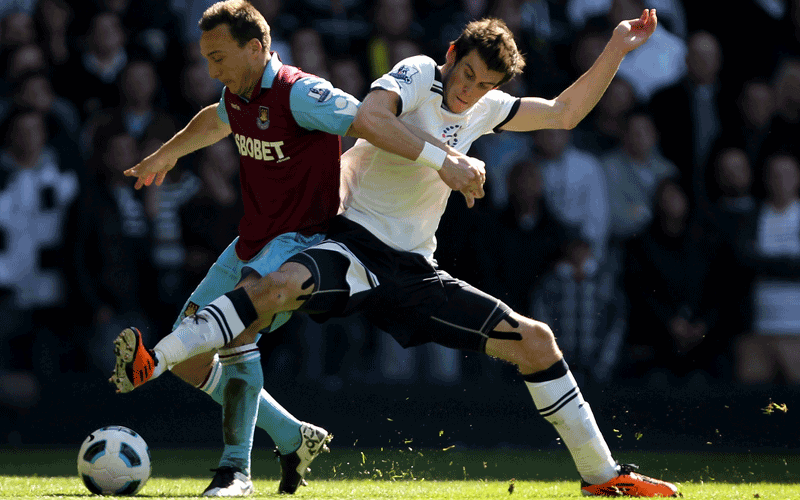 Mark Noble (L) of West Ham vies with Gareth Bale of Tottenham during the Barclays Premier League match between Tottenham Hotspur and West Ham United at White Hart Lane in London, England. (Getty Images)