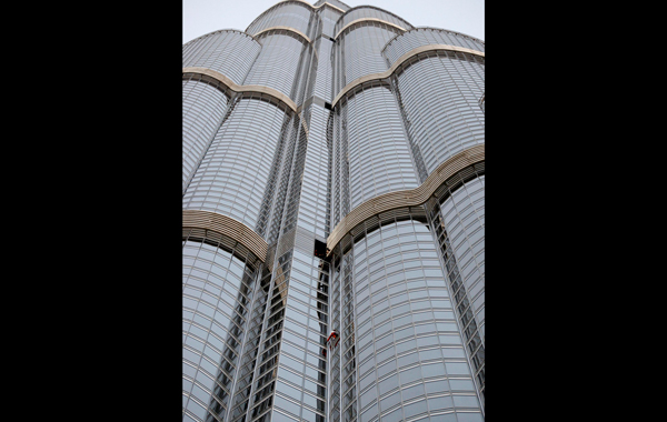 French climber Alain Robert, also known as "Spiderman", scales the world's tallest tower, the Burj Khalifa, with a height of 828 metres (2,717 ft), in Dubai. (REUTERS)