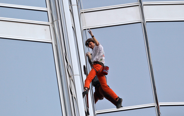 French Spider man Alain Robert climbs up Burj Khalifa, the world's tallest tower in Dubai, United Arab Emirates. (AP)