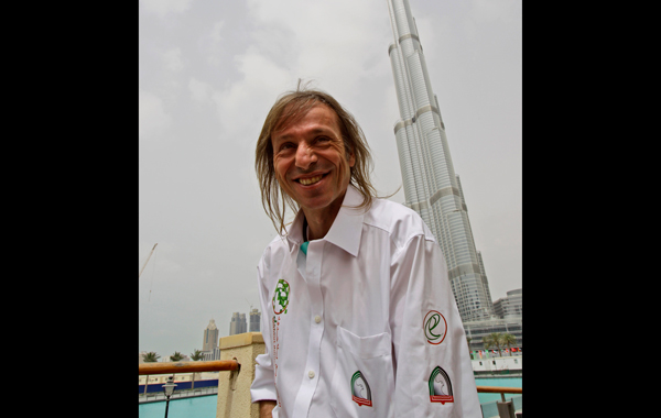 French climber Alain Robert, also known known as the "French Spiderman",  poses in front of Burj Khalifa, the world's tallest tower which is plans to climb. (AP)
