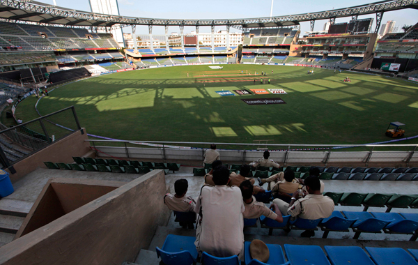 Police officers keep guard at the Wankhede stadium a day ahead of the final match of the Cricket World Cup between India and Sri Lanka in Mumbai, India. (AP)
