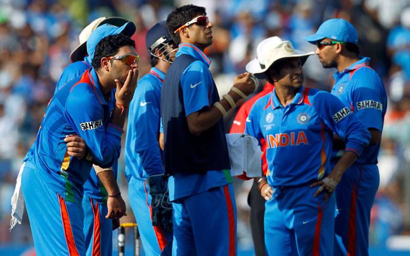 India's Yuvraj Singh (L) and his teammates wait for the review for the wicket of Sri Lanka's Thilan Samaraweera during their ICC Cricket World Cup final cricket match in Mumbai April 2, 2011. (REUTERS)