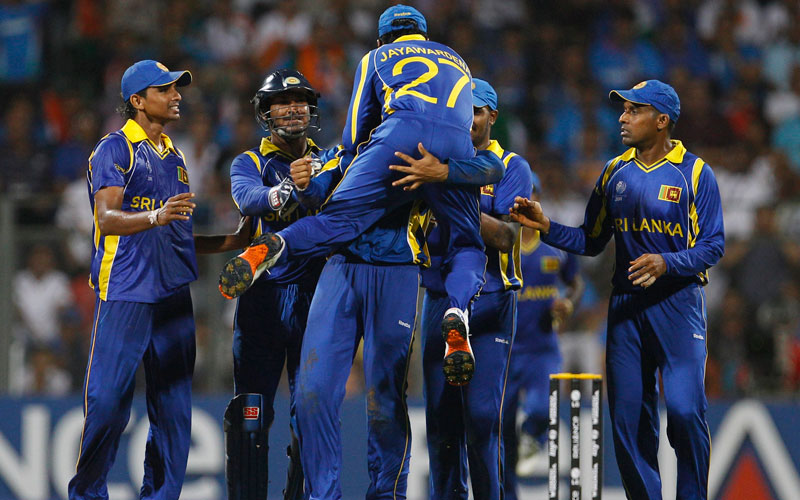 Sri Lanka's Mahela Jayawardene, back to camera, jumps to celebrate with fellow team members after the dismissal of India's Virat Kohli, not seen, during the Cricket World Cup final match between India and Sri Lanka in Mumbai, India, Saturday, April 2 , 2011 (AP)