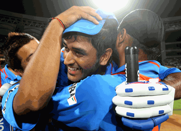 MS Dhoni (centre) of India celebrates victory with team mates Suresh Raina (left) and Harbhajan Singh after the final at Wankhede Stadium on Saturday in Mumbai, India. (GETTY)