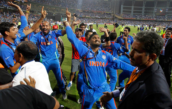 India's players including Yusuf Pathan (2nd L) and Harbhajan Singh (C) dance in celebration after India won their ICC Cricket World Cup final match against Sri Lanka in Mumbai. (REUTERS)