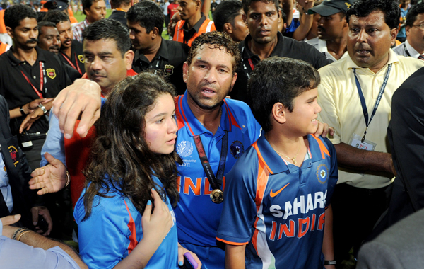 Indian player Sachin Tendulkar (C) walks with his daughter Sara (L) and son Ramesh (R) after India defeated Sri Lanka in the ICC Cricket World Cup 2011 final played at The Wankhede Stadium in Mumbai. (AFP)