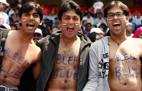 Indian cricket fans show their painted chests in the stadium ahead of the Cricket World Cup Group A match between England and India in Bangalore, India. (AP)