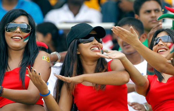 Cricket fans cheer before the start of the ICC Cricket World Cup match between Sri Lanka and Pakistan in Colombo, Sri Lanka. (AP)