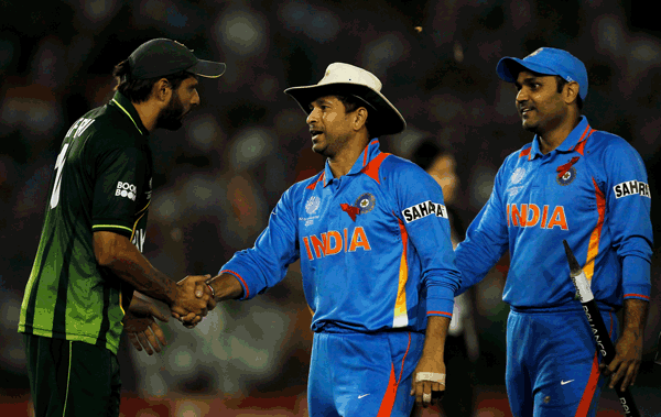 Pakistan captain Shahid Afridi (left) congratulates Sachin Tendulkar of India during the ICC World Cup semifinal in Mohali, India. (GETTY)