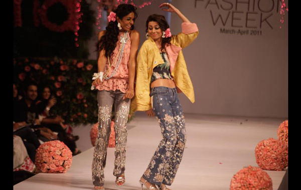 Models present creations by local designers during a fashion week organized in Lahore, Pakistan. (AP)