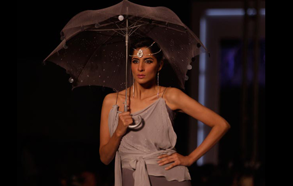 A model presents creation by a local designer during a fashion week organized in Lahore, Pakistan. (AP)