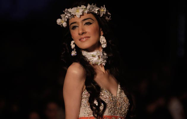 A model presents a creation by a local designer during a fashion week organized in Lahore, Pakistan. (AP)