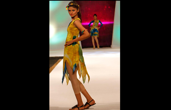 A model displays a creation by Pakistani designer Hira Lari during a fashion show in Karachi, Pakistan. (AP)