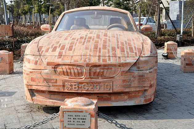 The brick BMW is on display in Jiangyin, Jiangsu province in China. The tyres, steering wheel, exhaust pipe and trimmings are made of brick. (AP)