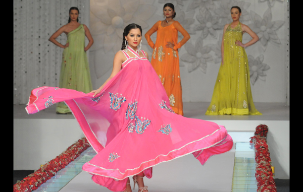 Model present creations by Pakistani designer La Chantal by Saba on the last day of Bridal Couture Week in Karachi. (AFP)