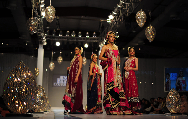 Models present creations by Pakistani designer Hajra Hayat on the 2nd  day of Bridal Couture Week in Karachi. (AFP)