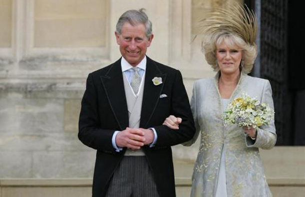 Prince Charles and The Duchess of Cornwall leave arm-in-arm from St. George's Chapel in Windsor Castle after the Service of Prayer and Dedication following their marriage, April 9, 2005.  (REUTERS)