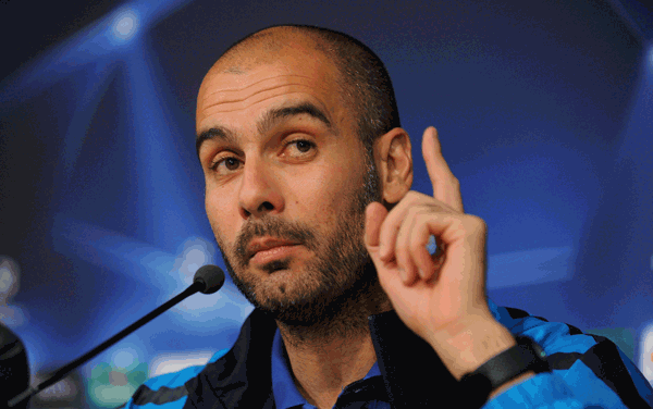 Pep Guardiola answers a question during a press conference. (GETTY)
