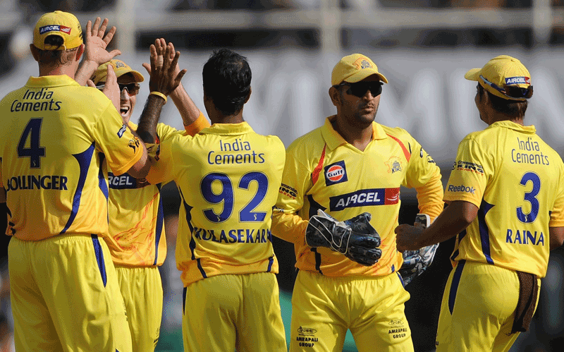 Chennai Super Kings captain Mahendra Singh Dhoni (second right) celebrates with Suresh Raina and other teammates after the wicket of Pune Warriors batsman Mithun Manhas (not pictured) during the IPL Twenty20 cricket match between Pune Warriors and Chennai Super Kings at The D.Y. Patil Cricket stadium in the outskirts of Mumbai. (AFP)