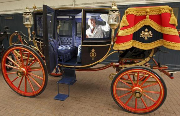 Carriage restorer Dave Evans cleans the Glass Coach at the Royal Mews in London, March 21, 2011. The coach will be used to carry Prince William and Kate Middleton for their wedding day. (REUTERS)