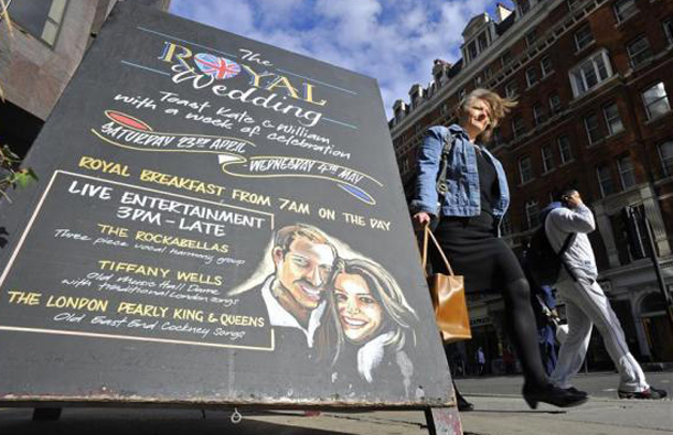 A sign stands outside a pub promoting Royal Wedding events, in central London, April 4, 2011. (REUTERS)