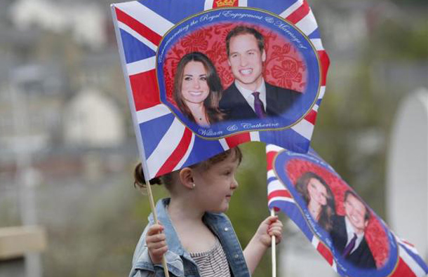 A young girl waits to see Prince William and Kate Middleton arrive at the Darwen Aldridge Community Academy in northern England, April 11, 2011. (REUTERS)