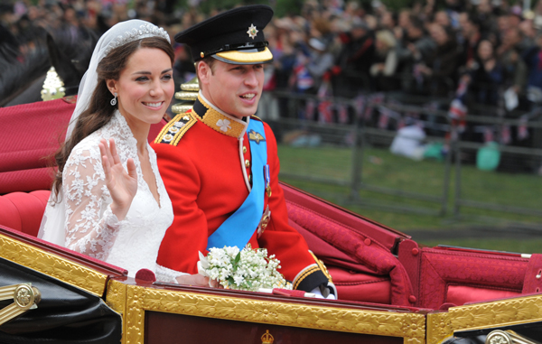 Their Royal Highnesses Prince William, Duke of Cambridge and Catherine, Duchess of Cambridge make the journey by carriage procession to Buckingham Palace past crowds of spectators following their marriage at Westminster Abbey. (GETTY)