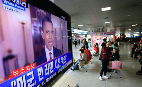 People watch a live TV reporting of U.S. President Barack Obama's speech about Osama bin Laden, at Seoul train station in Seoul, South Korea, Monday, May 2, 2011. Bin Laden, the glowering mastermind behind the Sept. 11, 2001, terror attacks that murdered thousands of Americans, was killed in an operation led by the United States, Obama said Sunday. The Korean read " U.S. soldiers, secure the body of bin Laden." (AP)
