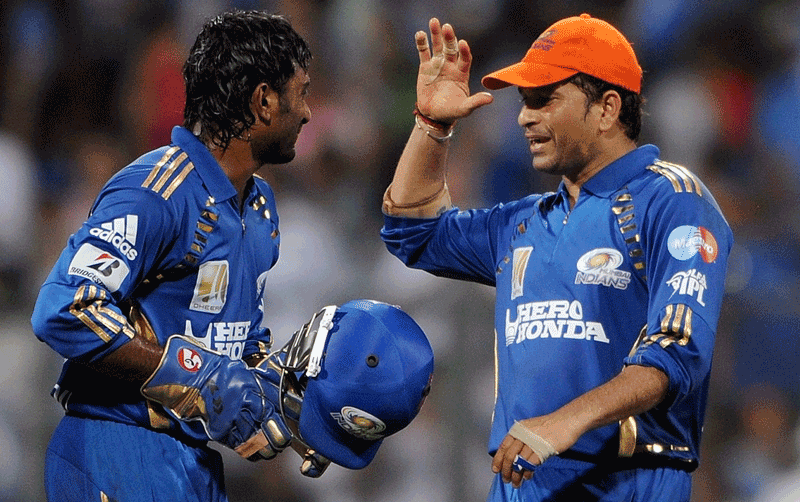 Mumbai Indians captain Sachin Tendulkar (right) celebrates with a teammate Ambati Rayudu after defeating Kings XI Punjab at the Wankhede Cricket stadium in Mumbai. (AFP)