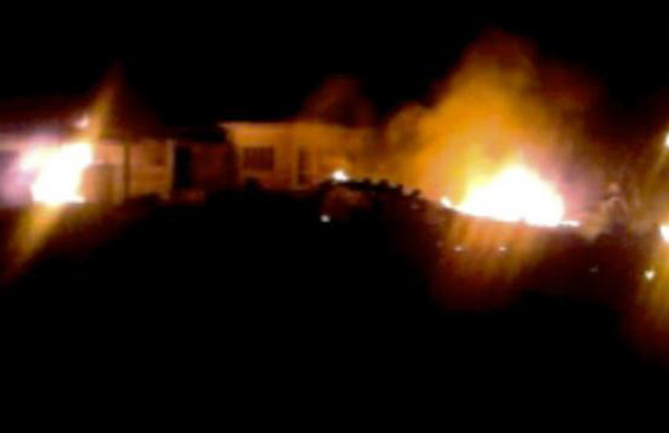 The compound, within which al Qaeda leader Osama bin Laden was killed, is seen in flames after it was attacked in Abbottabad in this still image taken from video footage from a mobile phone, May 2, 2011. (REUTERS)