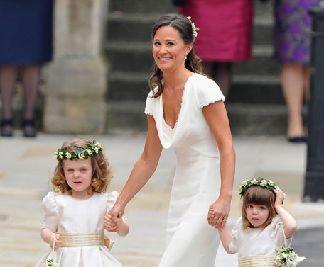 Sister of the bride and Maid of Honour Pippa Middleton holds hands with Grace Van Cutsem and Eliza Lopes as they arrive to attend the Royal Wedding of Prince William to Catherine Middleton at Westminster Abbey on April 29, 2011 in London, England. The marriage of the second in line to the British throne is to be led by the Archbishop of Canterbury and will be attended by 1900 guests, including foreign Royal family members and heads of state. Thousands of well-wishers from around the world have also flocked to London to witness the spectacle and pageantry of the Royal Wedding.  (GETTY IMAGES)