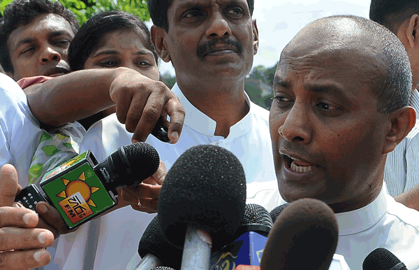 Former Sri Lanka captain Hashan Tillakaratne speaks to the media in Colombo on Tuesday. (AFP)
