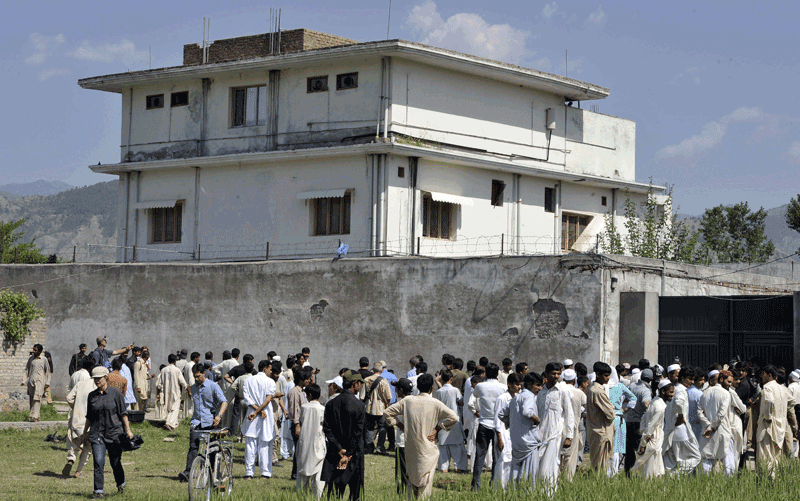Pakistani media personnel and local residents gather outside the hideout of Al-Qaeda leader Osama bin Laden following his death by US Special Forces in a ground operation in Abbottabad. The bullet-riddled Pakistani villa that hid Osama bin Laden from the world was put under police control, as media sought to glimpse the debris left by the US raid that killed him. Bin Laden's hideout had been kept under tight army control after the dramatic raid by US special forces late May 1, 2011 in the affluent suburbs of Abbottabad, a garrison city 50 kilometres (30 miles) north of Islamabad. (AFP)