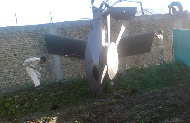 Part of a damaged helicopter is seen lying near the compound after U.S. Navy SEAL commandos killed al Qaeda leader Osama bin Laden in Abbottabad, May  2, 2011. (REUTERS)